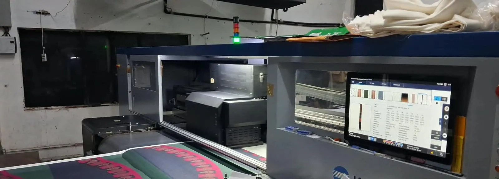 Printed fabric leaving the belt of Fabloom's Konica Minolta Nassenger 8 digital textile printer